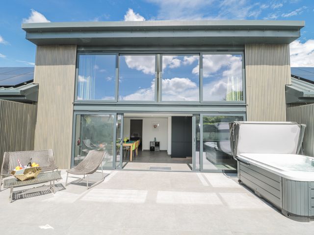 An outdoor area with seating and hot tub at Number 7 Bishop Sutton