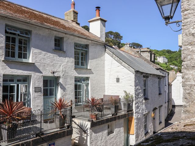 An outdoor view of buildings and plants at Teana Cottage in Polperro