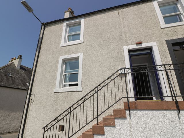 Exterior view of a building with windows and stairs at Fleet Townhouse in Castle Douglas