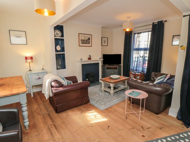 A living room with a sofa and coffee table at 1 Albion Place Whitby
