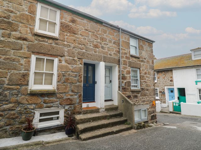 Exterior view of a stone building with steps and plants at Rockpools, 23 Carncrows Street St Ives