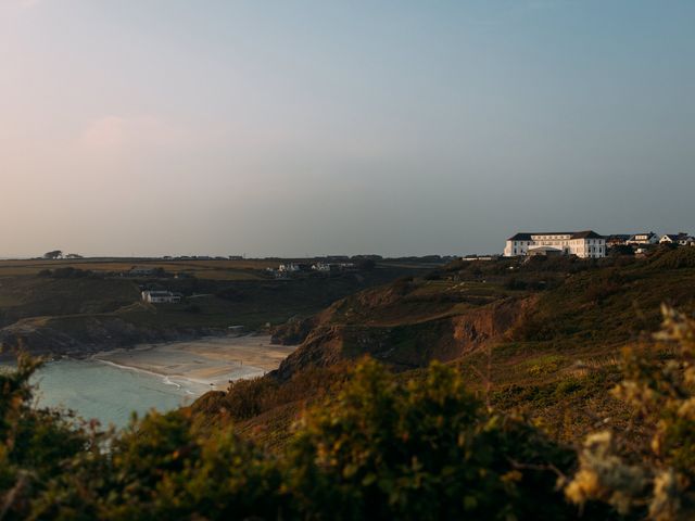 A coastal landscape with cliffs a sandy beach and houses on the hills at Villa 3 in Mullion