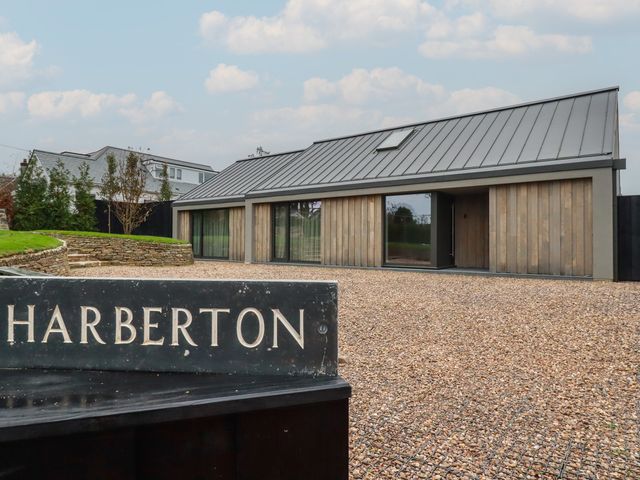 A house with a sign in front at Harberton