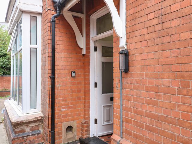 An entrance with brick wall and a front door at 2 Evington Road