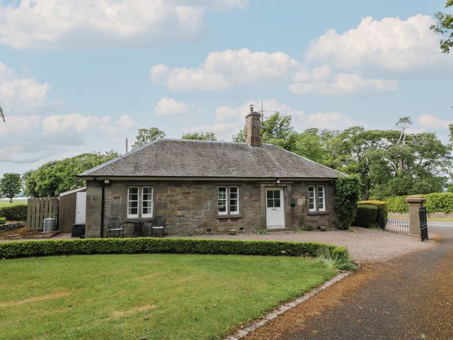 A house with a garden and driveway at Eagle Glen Cottage Kettins near Coupar Angus