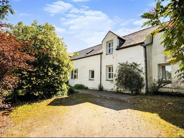A house with a garden and pathway at The Steading in Castle Douglas