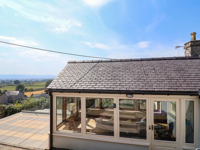 A house exterior with windows and a patio at Ael Y Bryn Dyserth