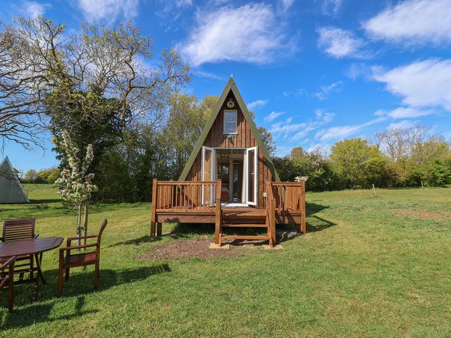 A house with a deck and outdoor seating at A-frame in Monewden near Otley, Suffolk