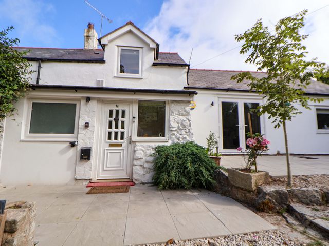 A house exterior with a pathway and plants at Cartref, Pen Y Ball near Holywell