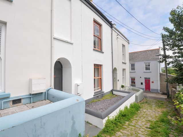 An outdoor view of houses and a pathway at 12 Alpha Place in Appledore