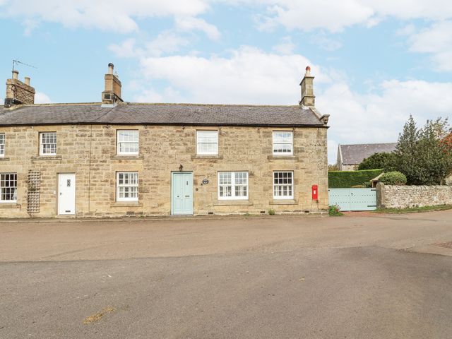 A house with windows and a blue door at Peary House in Alnwick