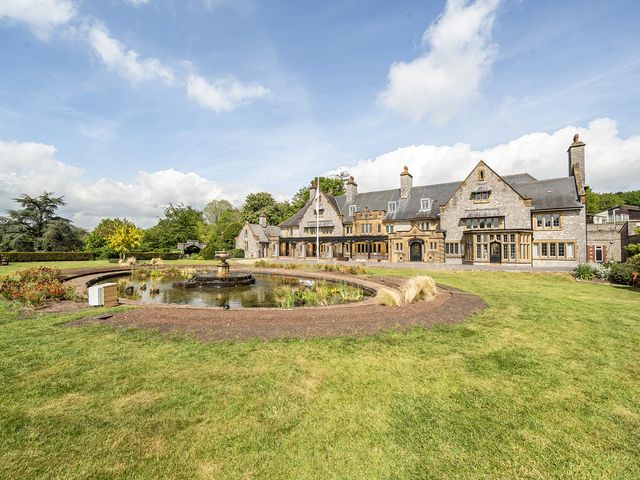 A large house with a pond and garden at Harcombe House Rooms - First Floor Twin, Chudleigh
