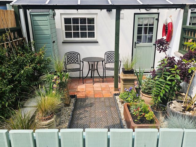 A garden with a table and chairs at Seaglass in Bridlington