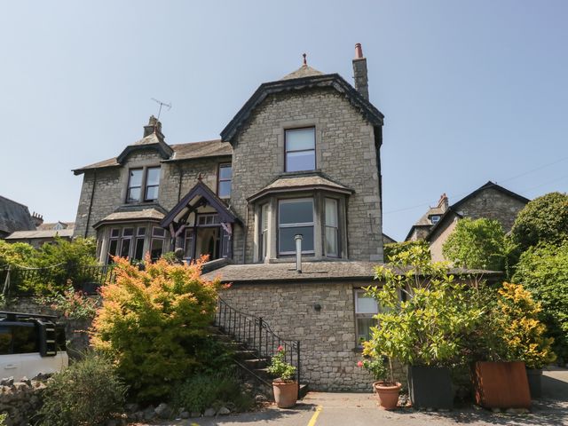 A house with a garden and steps at Lilac Cottage in Grange-Over-Sands