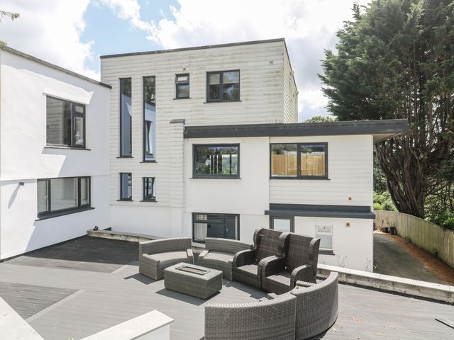 An outdoor area with seating and a table at Treliance in Truro