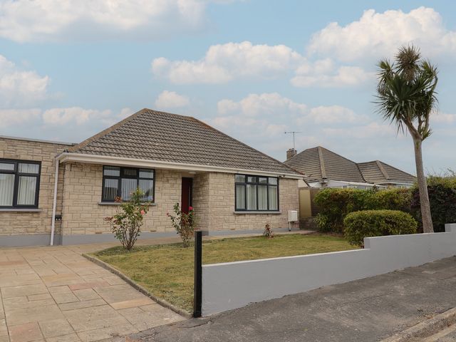A bungalow with a front yard at 7 Cedar Drive Preston