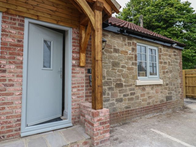 An entrance with a door and window at Cottage 10 in Brandon, County Durham