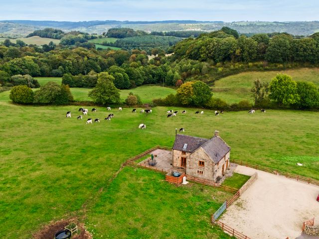 An aerial view of a house with cows in a field at Lane Head Cottage Alderwasley near Wirksworth
