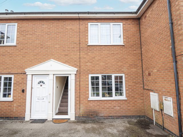 An exterior view of a house with a door and windows at 5 Links Court in Skegness