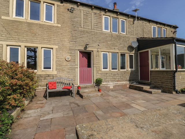 An outdoor area in front of a house at Stone & Fleece Cottage Holmfirth