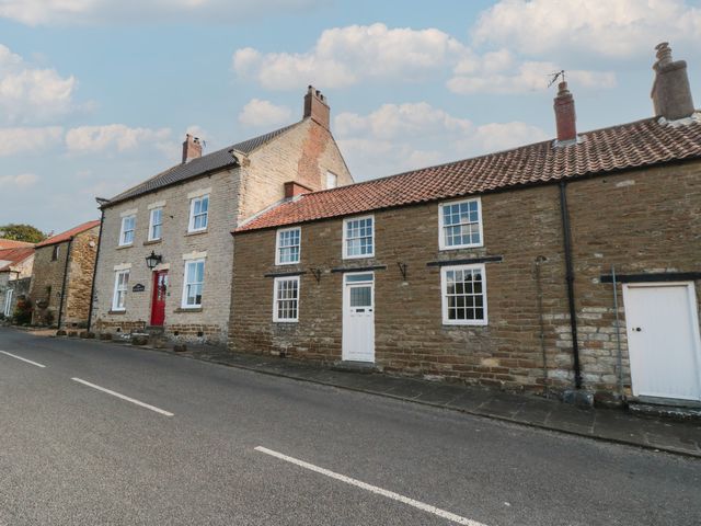 A row of houses along a road at 32 Castlegate in Scarborough