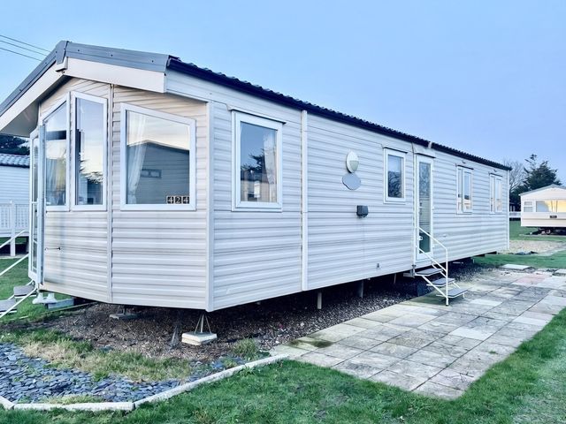 A caravan with windows and steps in Clacton-On-Sea