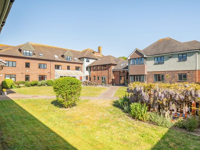 An outdoor view of buildings and pathways at Marine Court Second-floor Double Bedroom with Bathroom in Littlehampton