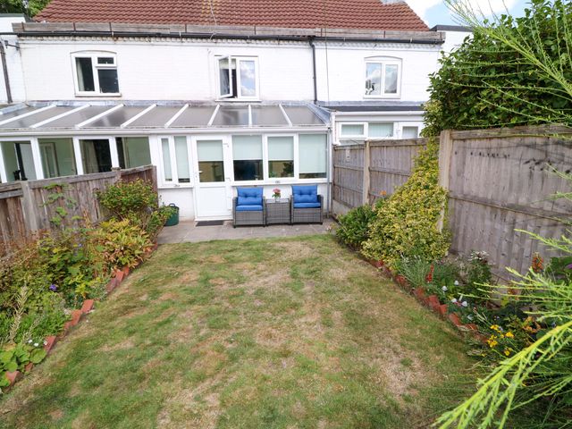 A garden with seating and plants at 37 East Lane Mansfield