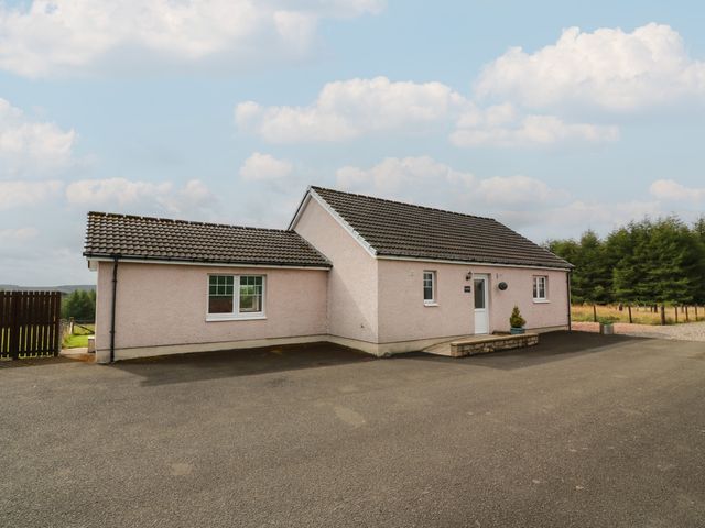 A house with a driveway at The Dairy in Airdrie