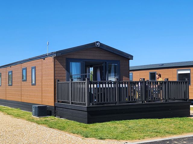 A vacation home with decking at Wave Whisperers - Hayling Island