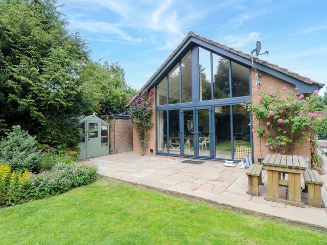 A house with large windows and garden features at Lawnswood