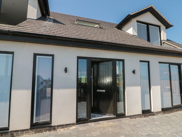 An entrance with door and windows at 12 Gap Road in Filey