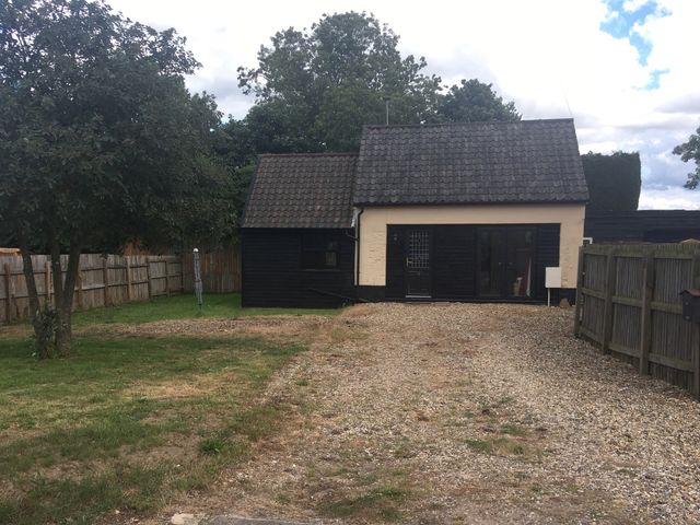 A house with a gravel driveway and trees at 1a Old Norwich Road Marsham near Aylsham