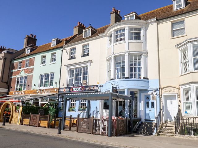 A restaurant building with outdoor seating at The Beach Condo in Weymouth
