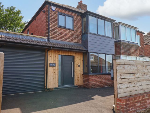 A house with garage and door at 12 Hunley Avenue Brotton near Saltburn-By-The-Sea