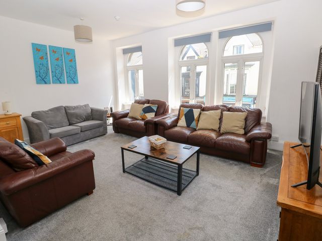 A living room with sofas and a coffee table at Flat 56 Newton Road in Mumbles