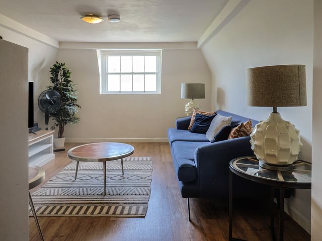 A living room with a sofa and coffee table at FLAT 3 54a broad Street (2 bed sleeping 4) Lyme Regis