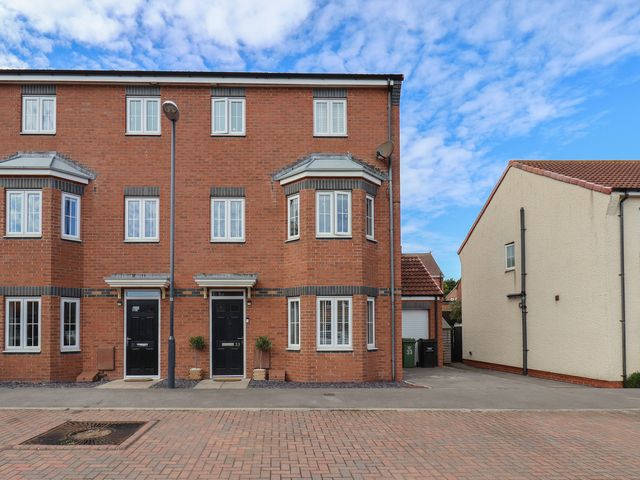 A building with multiple windows and doors at 33 Murrayfield Gardens in Whitby