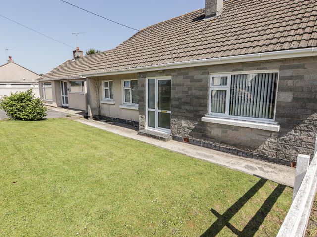A house with a garden and pathway at No.1 Vanderhoof Way Saundersfoot