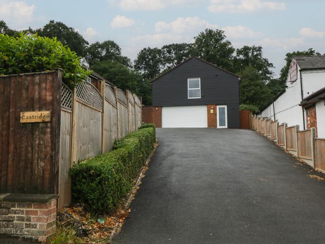 A house with a garage and fence at The Annex in 