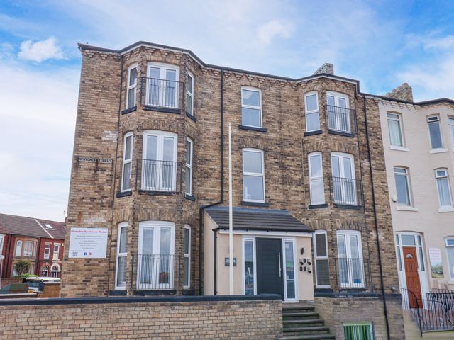 A building with multiple windows and a front entrance at Apartment 5 ( 1 bed ) in Redcar