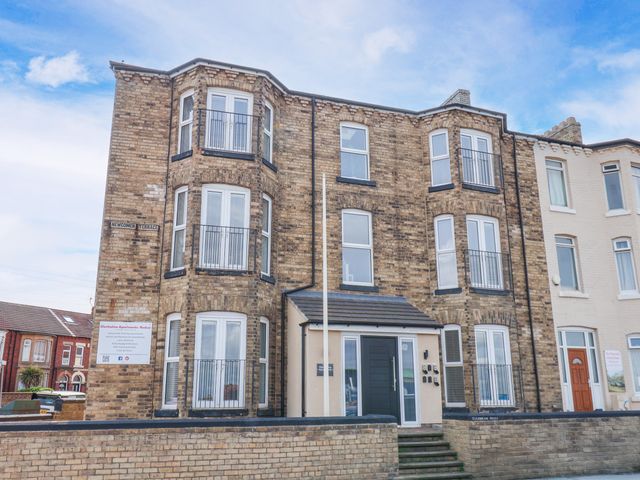 A building with balconies and windows at Apartment 6 ( 1 bed ) Redcar