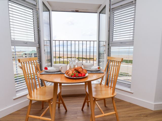 A dining area with a table set for breakfast at Apartment 6 (1 bed) Redcar