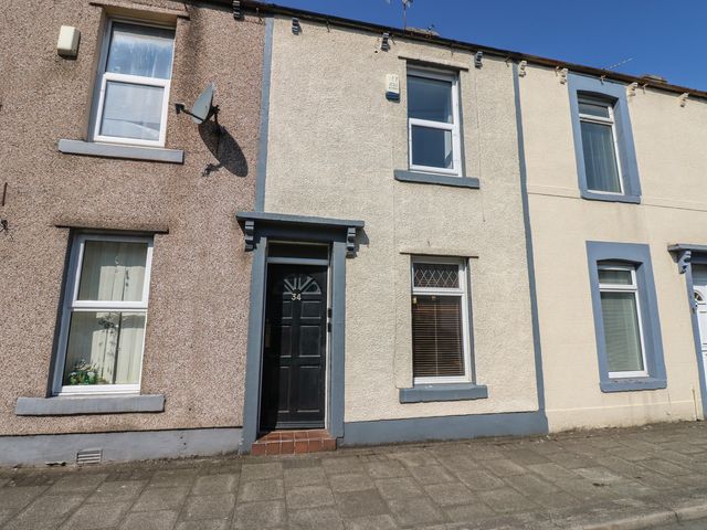 A building facade with windows and a front door at Bolton Terrace in Workington