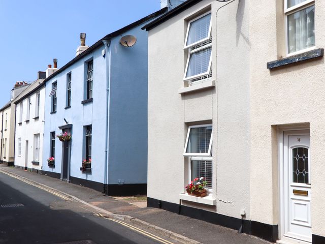 Houses with flower boxes on a street at Kenny Cottage in Dawlish