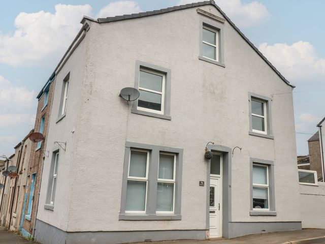 A house with multiple windows and a front door at Ennerdale Edge in Cleator