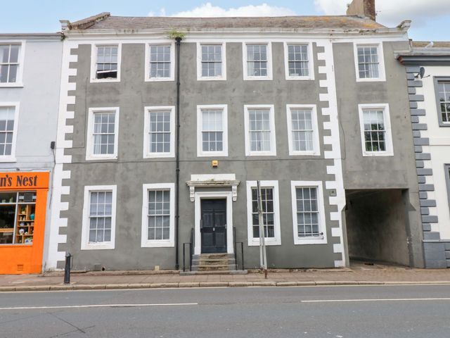 A building with multiple windows and a front door at Lowther Suite in Whitehaven