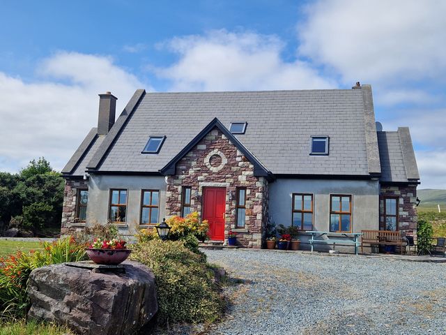 A house with a red door and garden at Moynish Mor Mulranny Mulranny, County Mayo