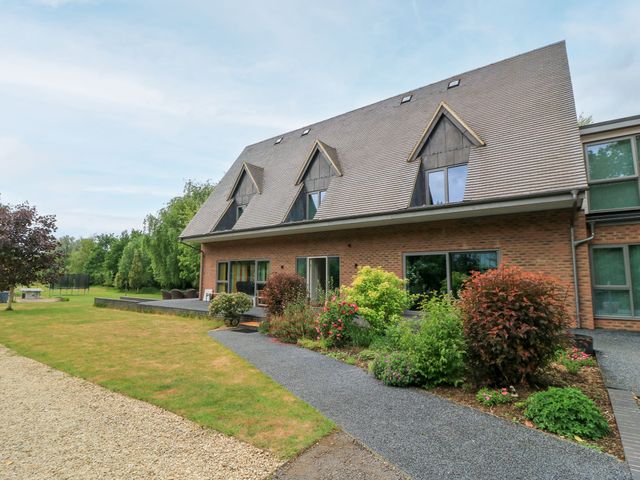 A house with a garden and pathway at Silver Copse Frilford Heath Near Abingdon
