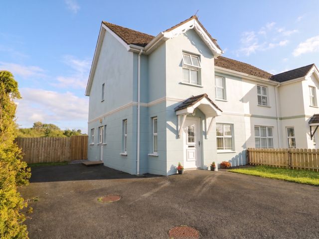 A house with a front door and driveway at The Sperrin Getaway in Omagh